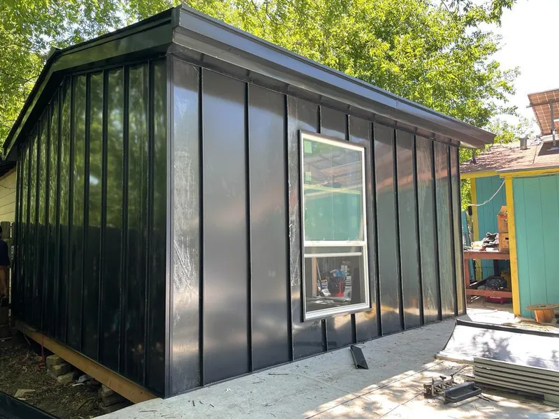 Black standing seam metal wall panels for Roof Inspection in West Clarkston-Highland