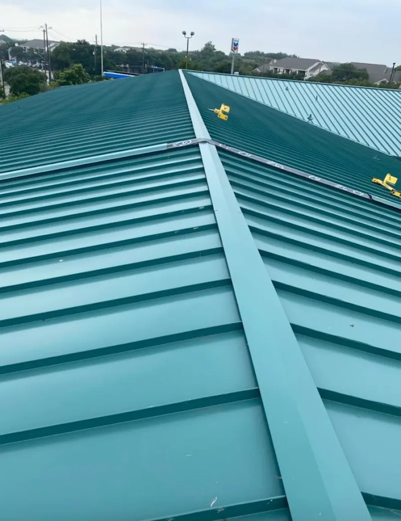 Green commercial metal roof ridge and valley for Metal Roof Repair in West Clarkston-Highland